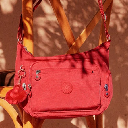 Kipling：独立日大促 Sabian 斜挎包$25 粉猩猩包挂$9
